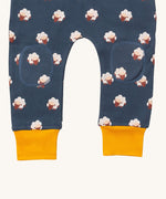 A close up of the Little Green Radicals comfy joggers in sleeping sheep showing kneepatch detail and yellow cuff trim on navy organic cotton fabric