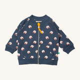 Little Green Radicals reversible easy rider jacket in sleeping sheep. A GOTS organic cotton bomber jacket style in navy with a full length zip, pouch pockets and cute prints of white sheep. 