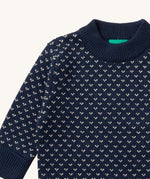 A close up of the Little Green Radicals navy sheep design showing the thick navy cuff and hem detail and a close up of the white speckles on navy organic cotton fabric