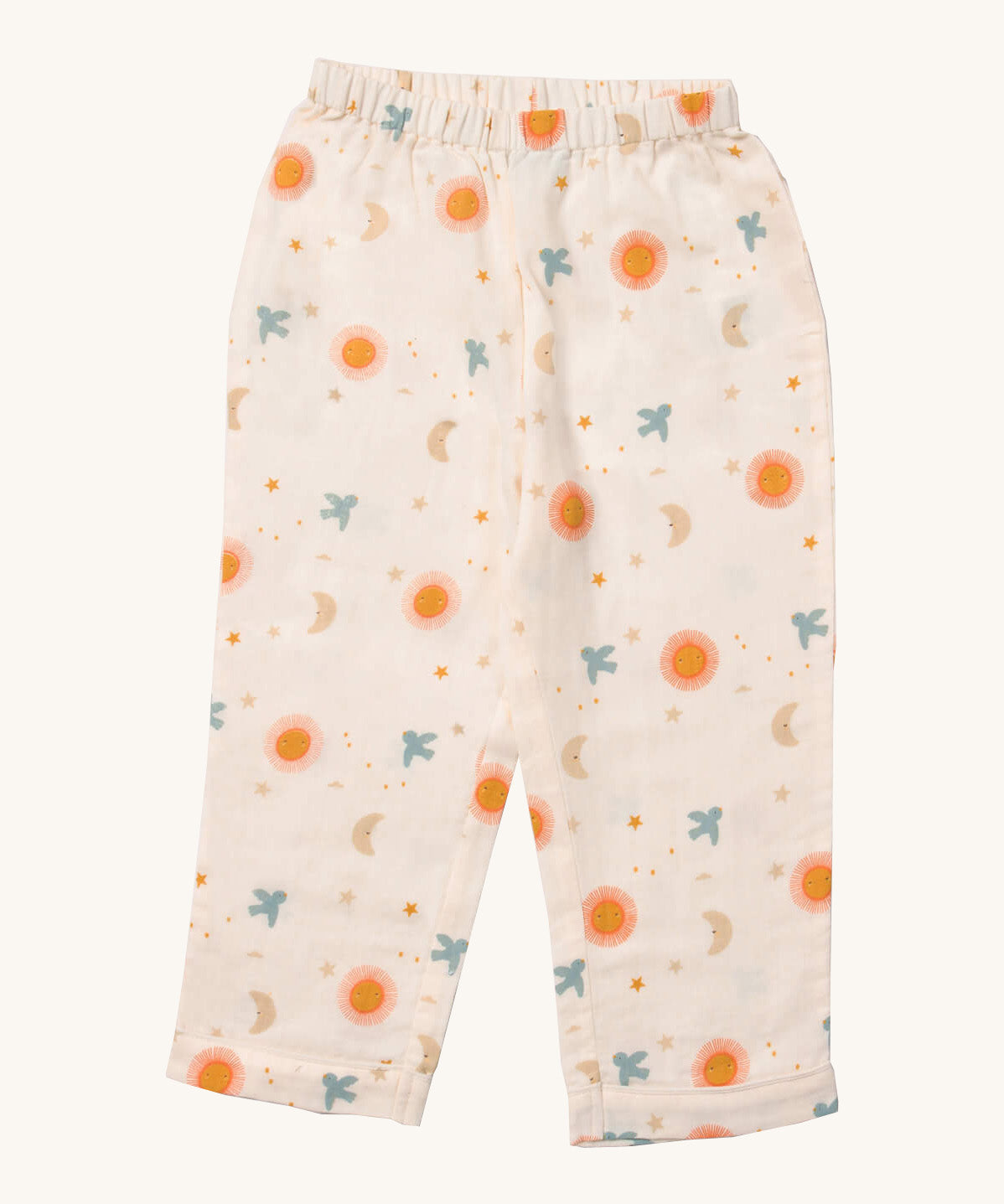 Little Green Radicals classic pyjama bottom from the moon and sun classic set. A GOTS organic cotton pyjama bottom
in light pink with a starry night design with the sun and a flying blue bird. Features a elasticated waist band for a comfortable fit
