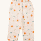 Little Green Radicals classic pyjama bottom from the moon and sun classic set. A GOTS organic cotton pyjama bottom
in light pink with a starry night design with the sun and a flying blue bird. Features a elasticated waist band for a comfortable fit
