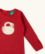 Close up of the applique on the front of the Little Green Radicals sleeping swan applique long sleeve organic cotton top in red.