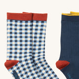 A close up of the blue and white check Little Green Radicals ankle socks showing check design with red trim detail on soft organic cotton fabric
