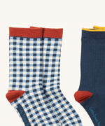 A close up of the blue and white check Little Green Radicals ankle socks showing check design with red trim detail on soft organic cotton fabric