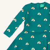 A close up of the Little Green Radicals rainbow turquoise twirly dress showing the long sleeve and popper detail

