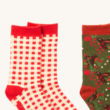 A close up of the red and white check Little Green Radicals ankle socks showing check design with red trim detail on soft organic cotton fabric