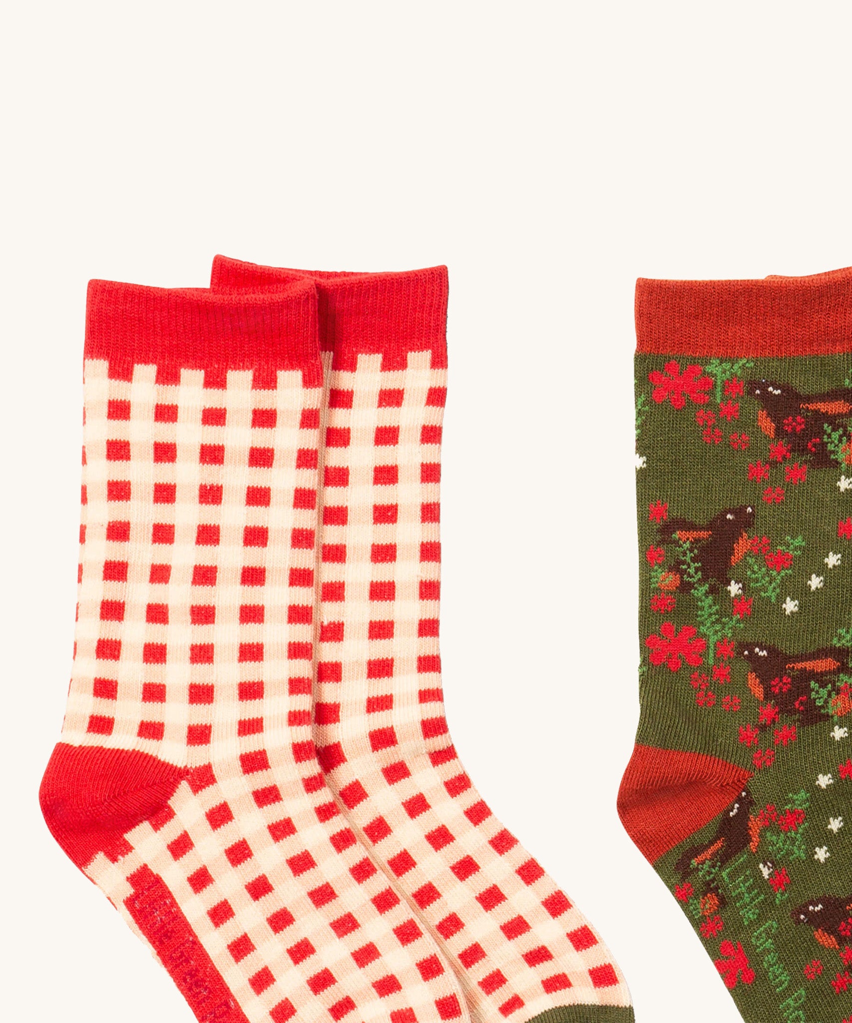 A close up of the red and white check Little Green Radicals ankle socks showing check design with red trim detail on soft organic cotton fabric