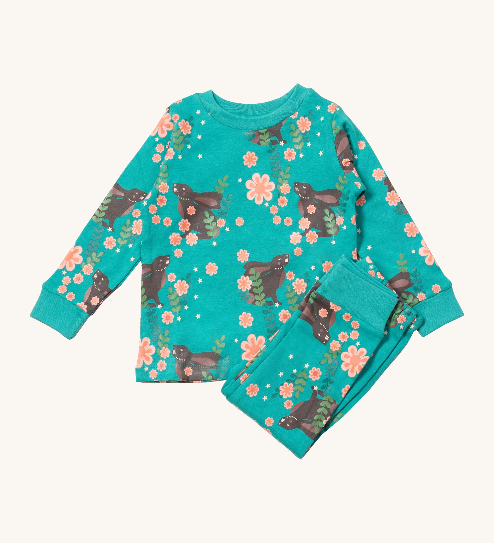 Little Green Radicals winter rabbits pyjama set available at Babipur.. A GOTS organic cotton pyjama top and bottom set in turquoise with matching trim and prints of rabbits in pink flowers