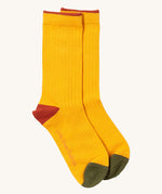 Little Green Radicals yellow block ankle socks from the winter rabbit set available at Babipur. A soft ribbed GOTS organic cotton sock with green and red trim.
