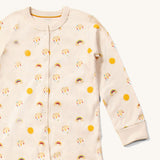 Close up of the front of the LGR Adaptive Sunshine & Rainbows Sleepsuit showing the popper closure