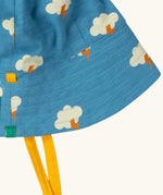 Close up of the Little Green Radicals all weather reversible children's organic cotton sunhat showing the yellow gold chin ties. 