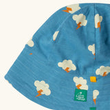 Close up of the Little Green Radicals all weather reversible children's organic cotton sunhat. Blue hat with all over cloud with lightning strike print. 