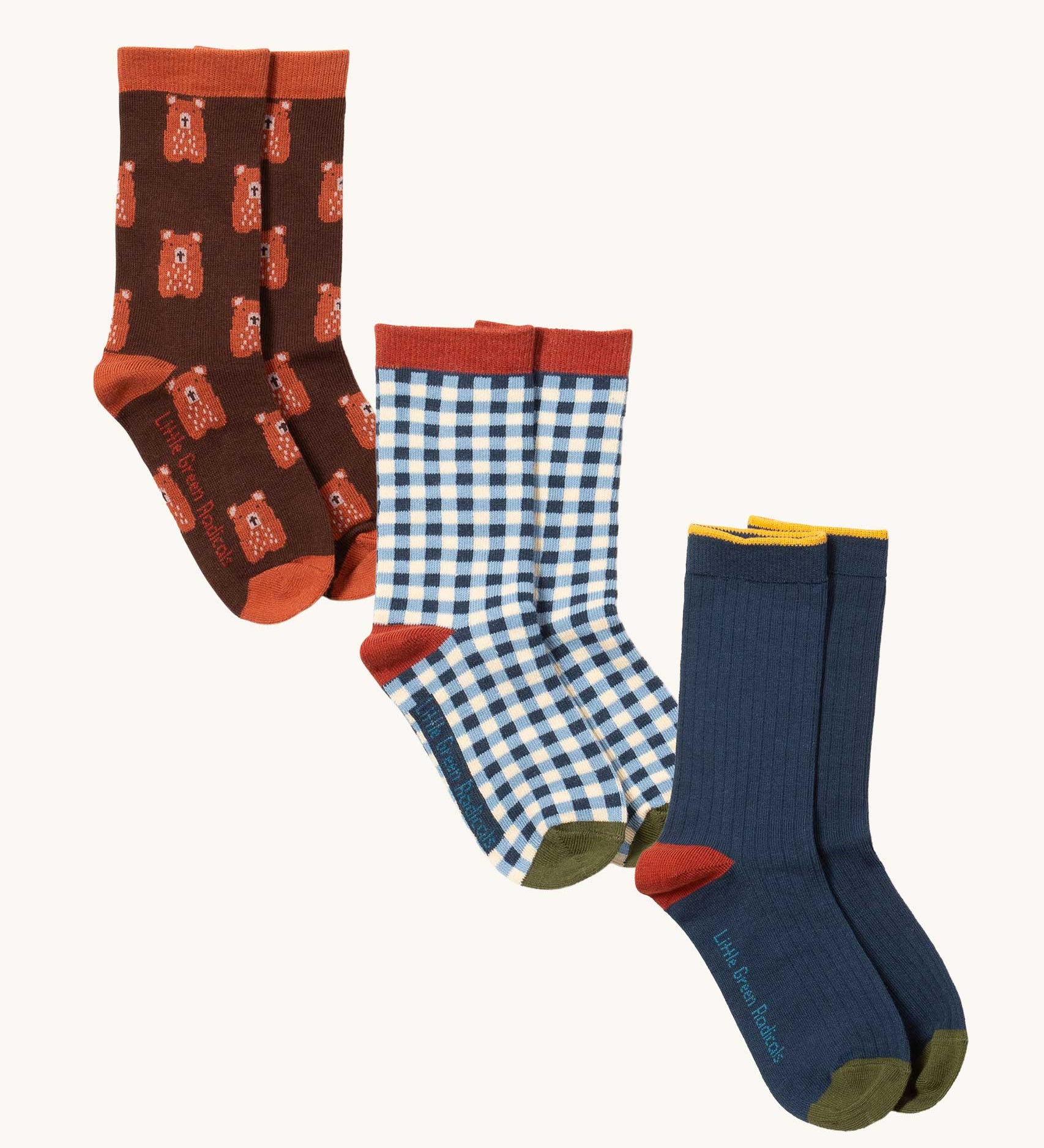 Three pairs of organic and Fairtrade cotton socks by Little Green Radicals - brown teddy bears, blue and white gingham and navy colour block - available to buy now at Babipur.