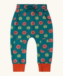 Little Green Radicals apple picking green comfy organic cotton joggers with red leg cuffs. Repeat green and red apple print on a dark green background. 