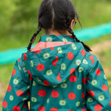 Close up of the hood on the Little Green Radicals apple picking recycled waterproof children's raincoat with a child wearing it. The hood is lined with a dark red mesh.