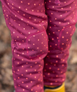 Close up of the knee patches on the Little Green Radicals autumn polkadot cosy cotton knee patch joggers.