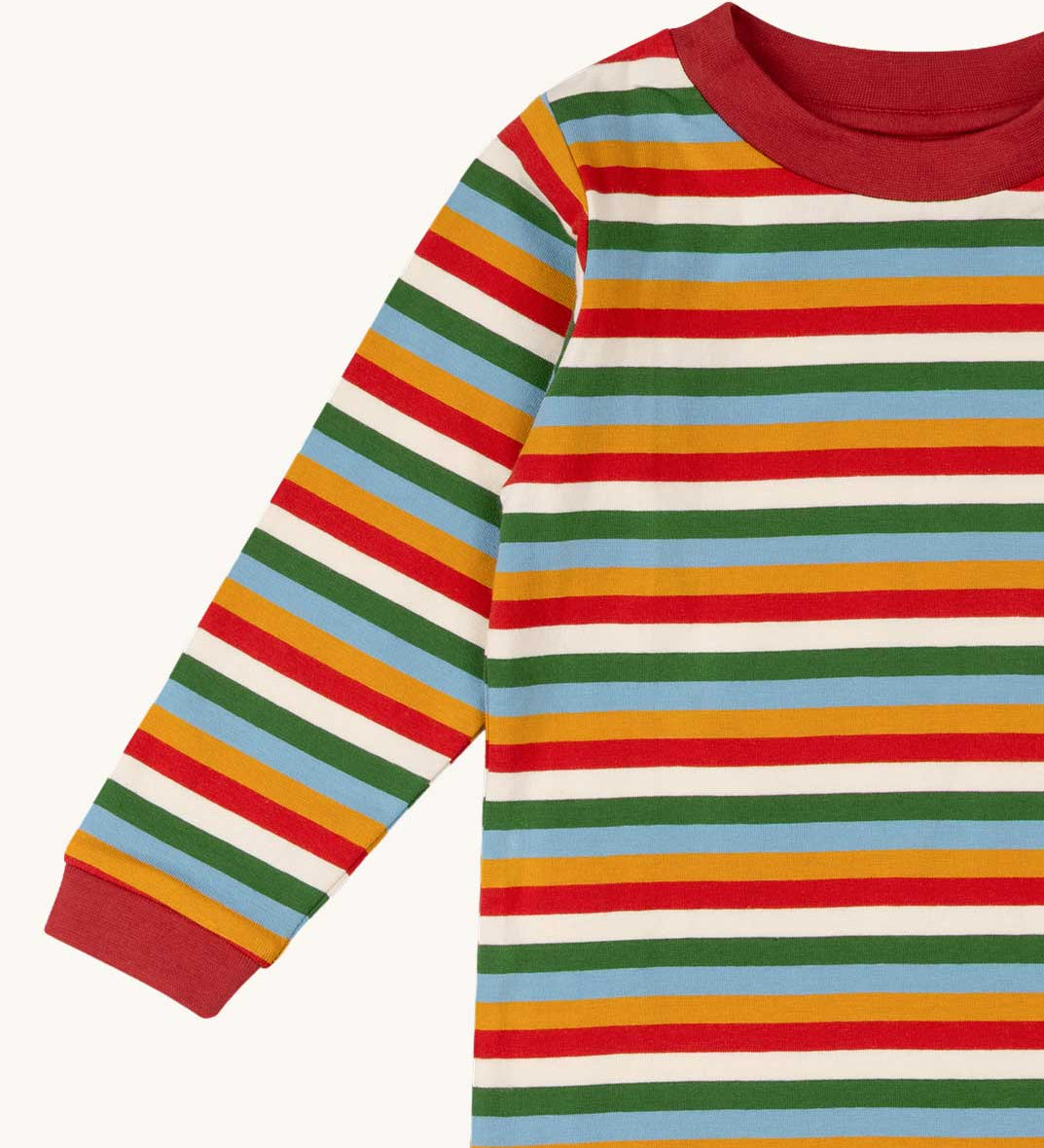 A close up of the Little Green Radicals autumn rainbow striped long sleeve top available at Babipur. A GOTS organic cotton top with long sleeves with autumn inspired coloured stripes with red collar and cuffs.