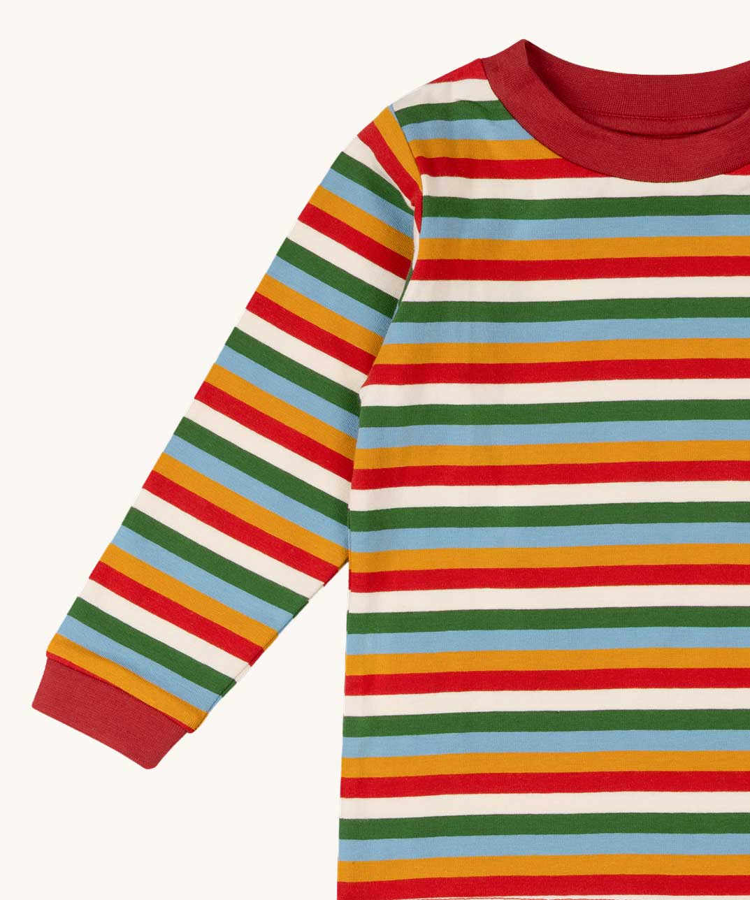 A close up of the Little Green Radicals autumn rainbow striped long sleeve top available at Babipur. A GOTS organic cotton top with long sleeves with autumn inspired coloured stripes with red collar and cuffs.