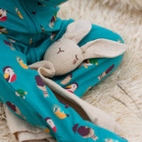 Little Green Radicals rabbit organic cotton baby comforter toy on a baby's lap.