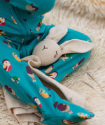 Little Green Radicals rabbit organic cotton baby comforter toy on a baby's lap.