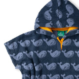 Close up of the poppered side and yellow lined hood on the Little Green Radicals organic cotton Singing Whales Baby Towel Poncho.