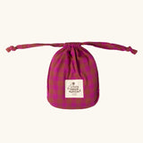 Bag that the Little Green Radicals Kids berry pink check organic cotton classic pyjamas come in. Button up long sleeve top and matching trousers. 