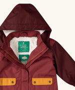 Close up of the Little Green Radicals berry purple recycled waterproof winter coat with the front zip half open showing the fleece lining. 