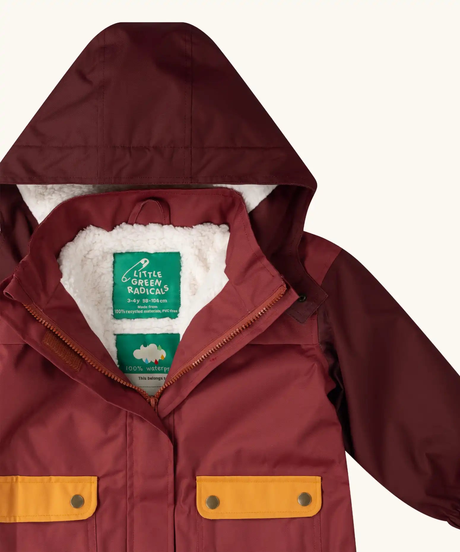 Close up of the Little Green Radicals berry purple recycled waterproof winter coat with the front zip half open showing the fleece lining. 