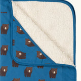 Close up of the Little Green Radicals bears organic sherpa hooded baby blanket showing the fluffy fleece lining. Blue hooded blanket with brown bears print.