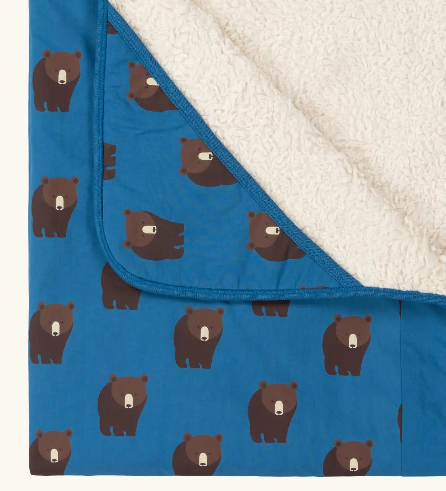 Close up of the hood on the Little Green Radicals bears organic sherpa hooded baby blanket. Blue hooded blanket with brown bears print. 