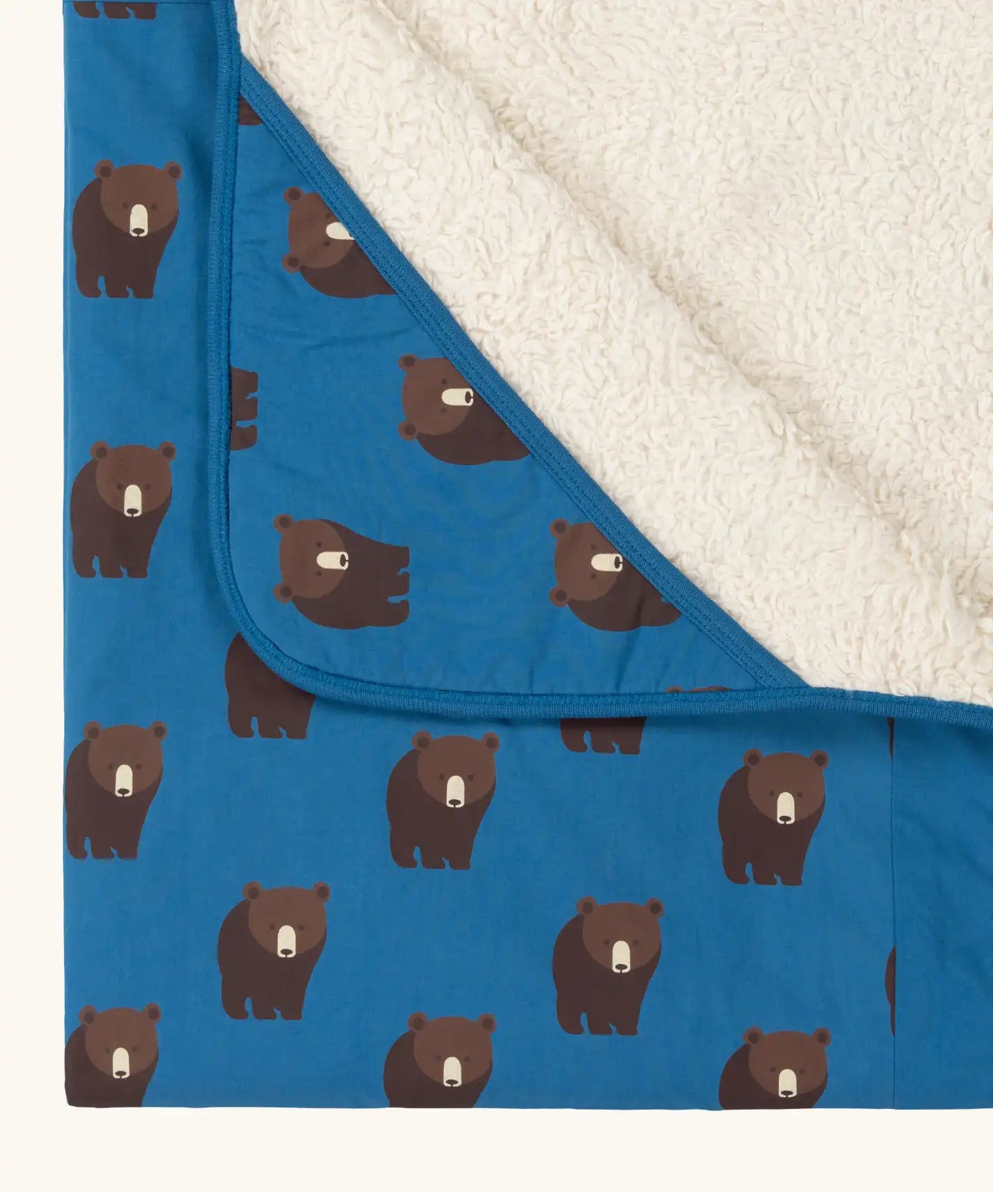 Close up of the hood on the Little Green Radicals bears organic sherpa hooded baby blanket. Blue hooded blanket with brown bears print. 