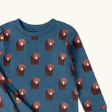 Close up of the Little Green Radicals blue bears organic cotton children's pyjamas. Blue background with an all over repeat brown bear print.