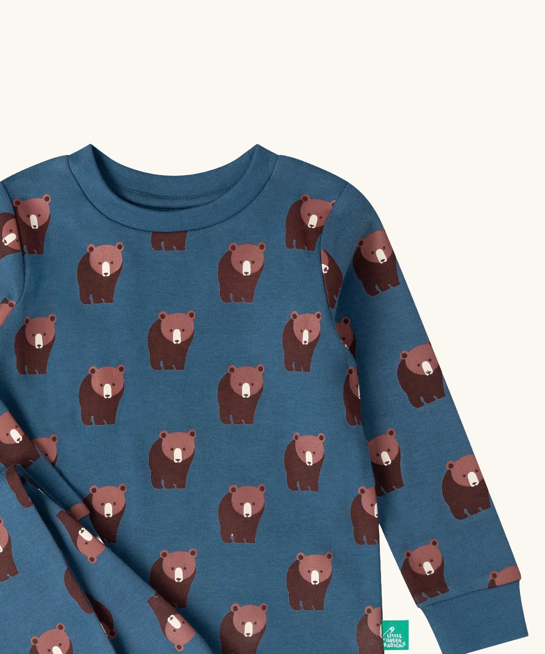 Close up of the Little Green Radicals blue bears organic cotton children's pyjamas. Blue background with an all over repeat brown bear print.