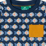 Close up of the Little Green Radicals little fish organic cotton t-shirt from the playset. A navy top with repeat fish print and a yellow chest pocket.