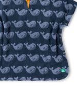 Close up of the material of the Little Green Radicals organic cotton Singing Whales Baby Towel Poncho.