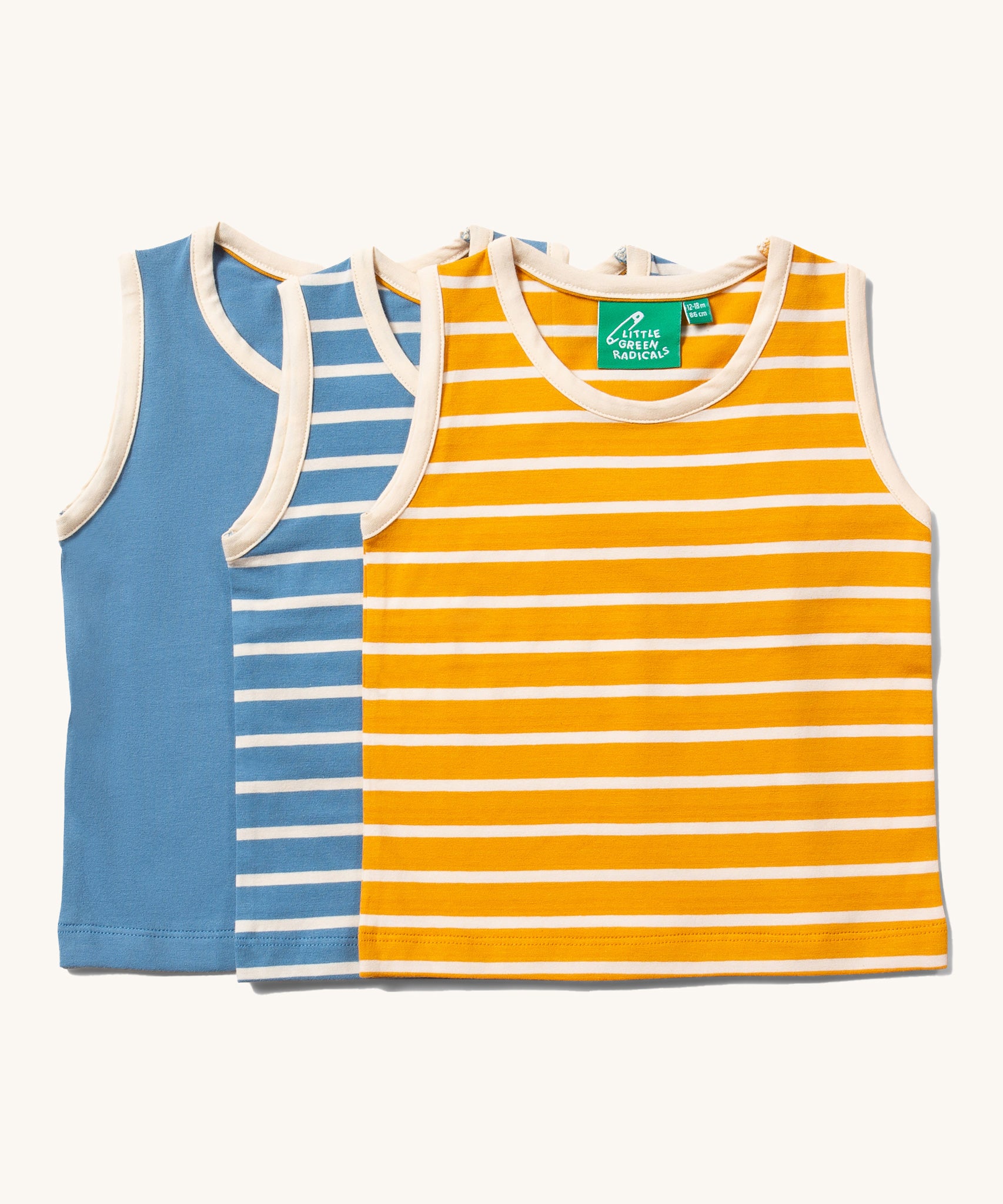 Little Green Radicals Organic Cotton sleeveless Vest Set in a 3 pack. One  has yellow and cream stripes, one  has blue and cream stripes and one is plain blue.