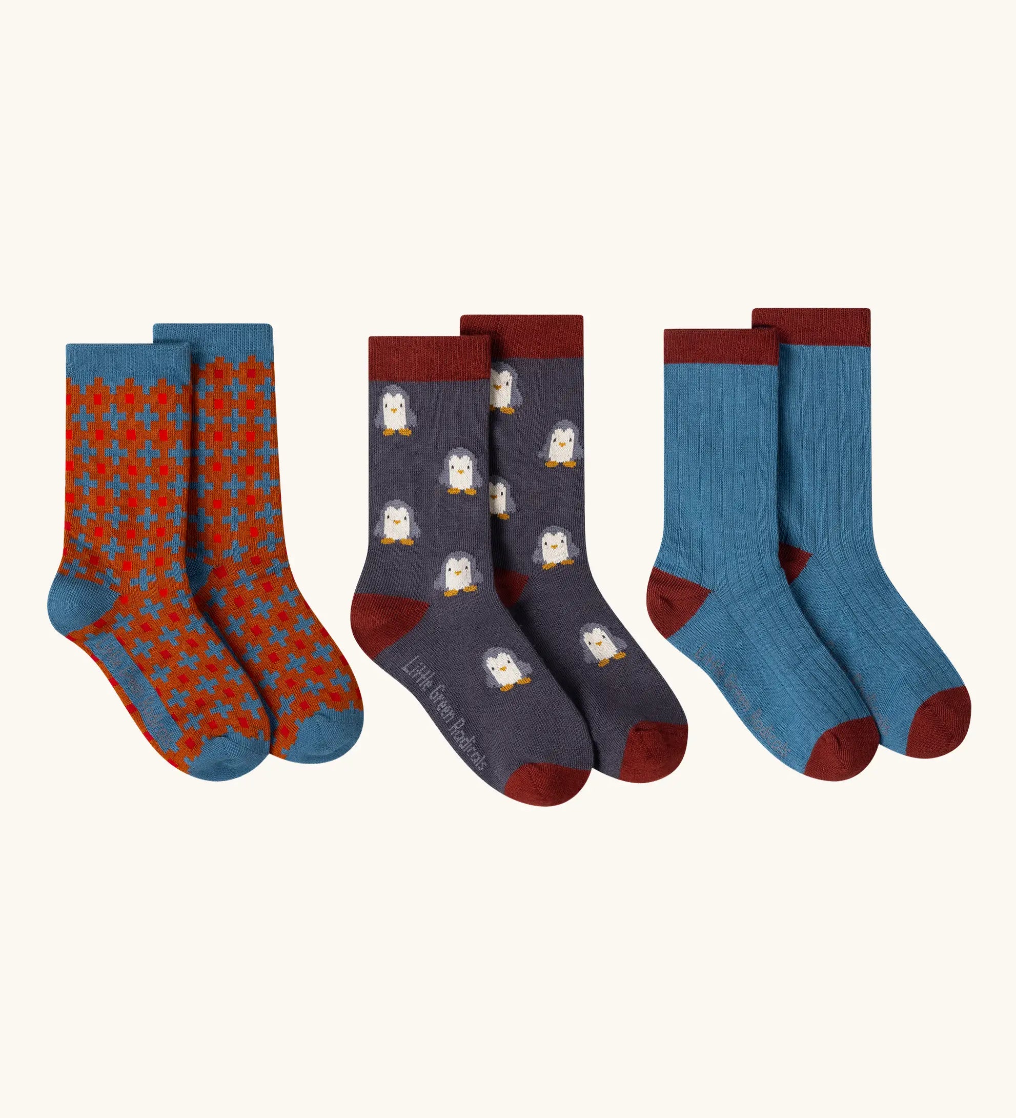 Little Green Radicals blue penguins organic cotton socks 3 pack. One blue with penguins, one plain blue and one ginger squares pattern. 