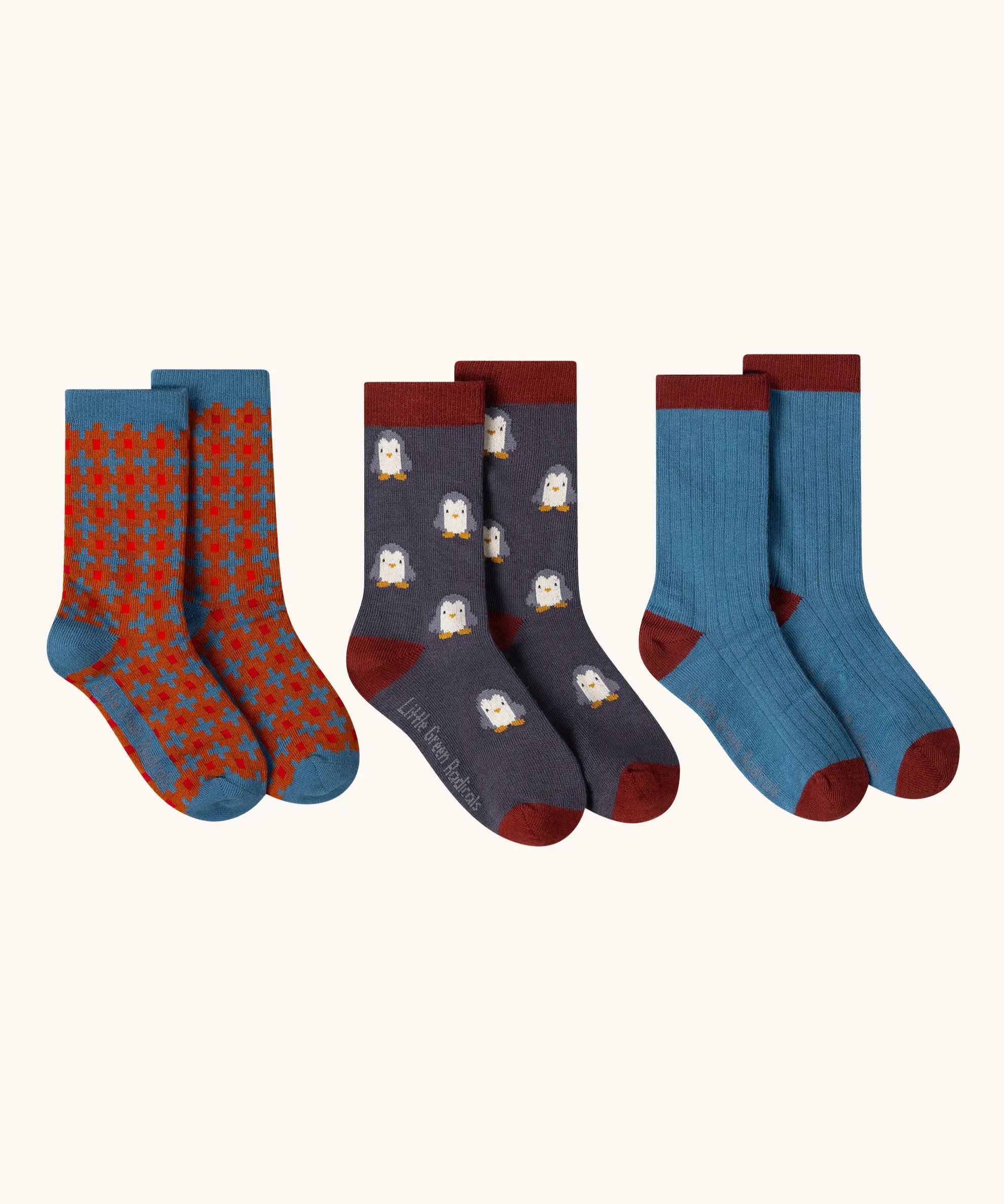 Little Green Radicals blue penguins organic cotton socks 3 pack. One blue with penguins, one plain blue and one ginger squares pattern. 