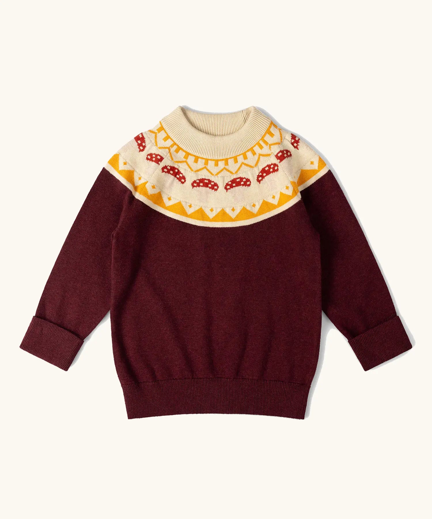 Little Green Radicals knitted organic cotton jumper with a mushroom Fair Isle. Brown jumper with mushroom air isle design around the neckline.