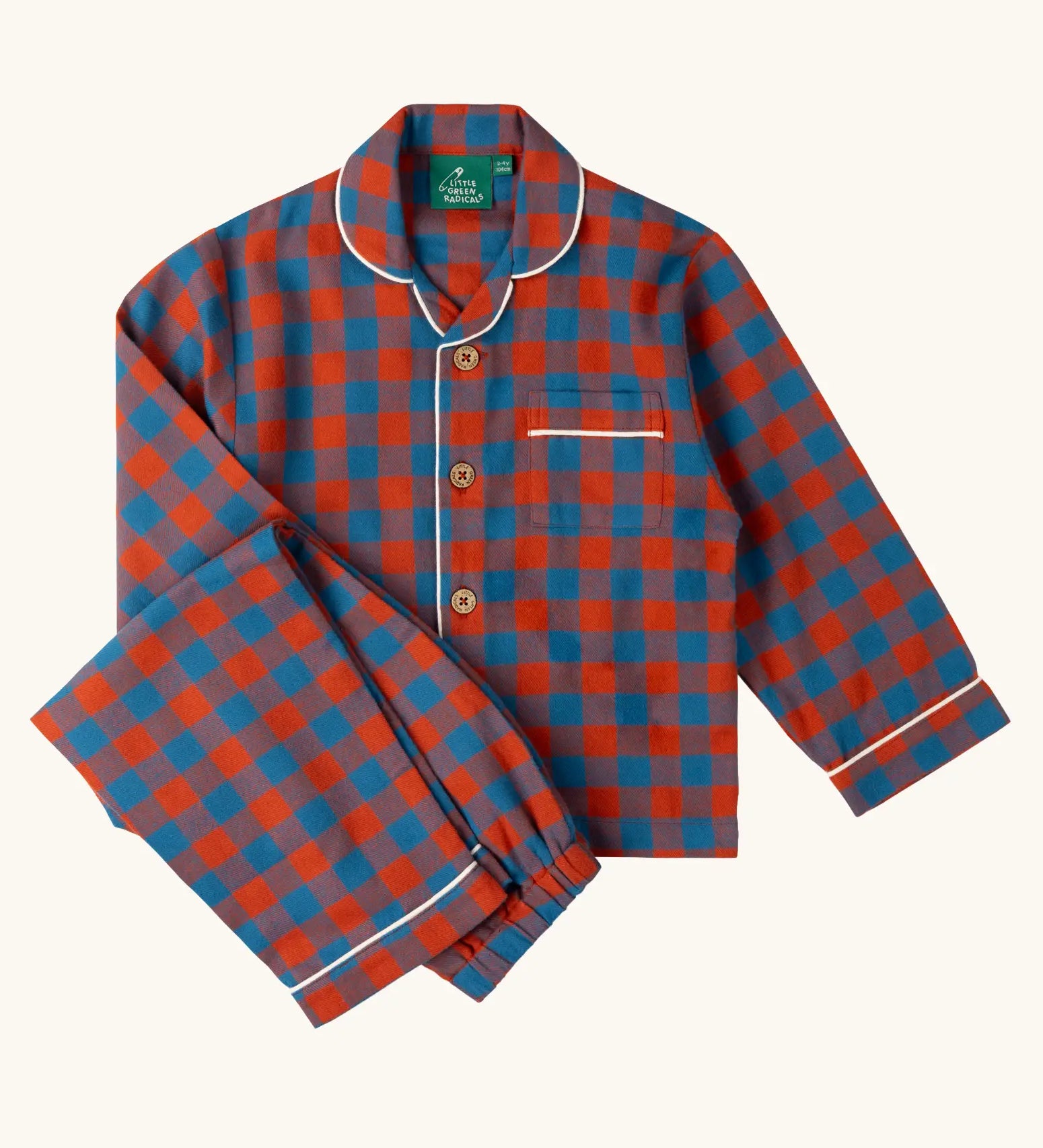 Little Green Radicals burnt ochre and blue check classic children's pyjamas. Long sleeve button up top with matching trousers.
