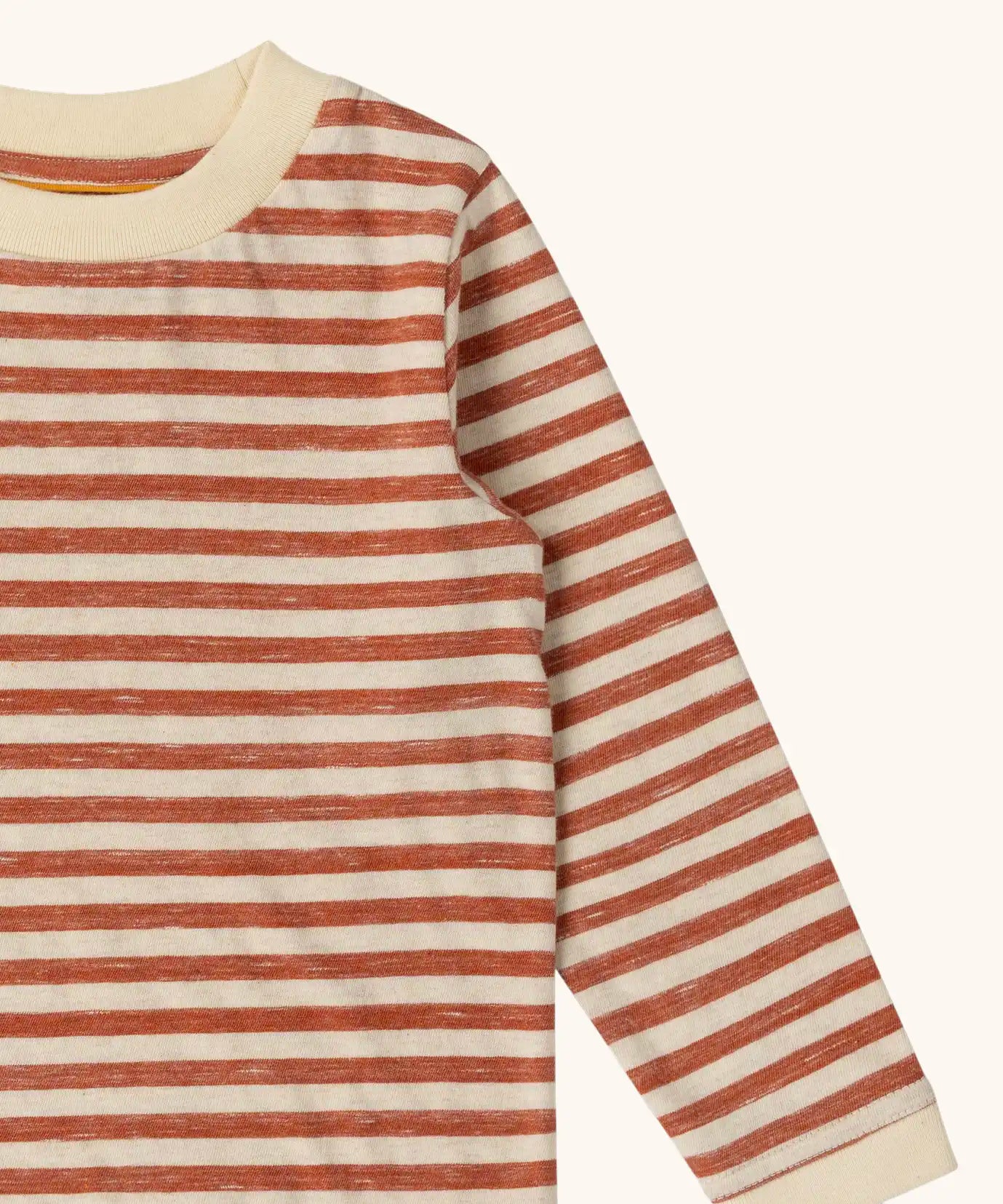 Close up of the Little Green Radicals burnt ochre stripe organic cotton long sleeve organic cotton children's top.