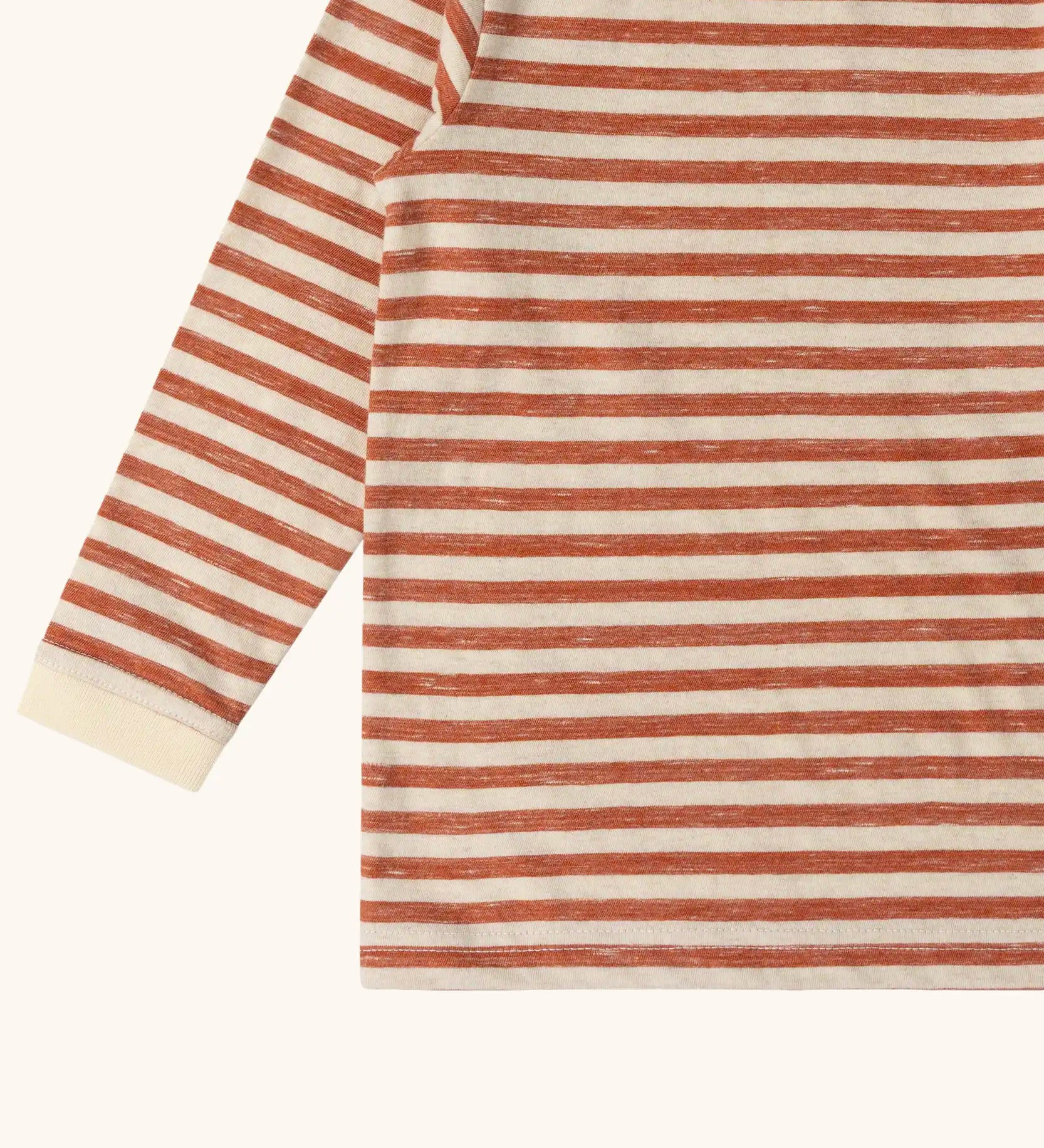 Close up of the Little Green Radicals burnt ochre stripe organic cotton long sleeve organic cotton children's top.
