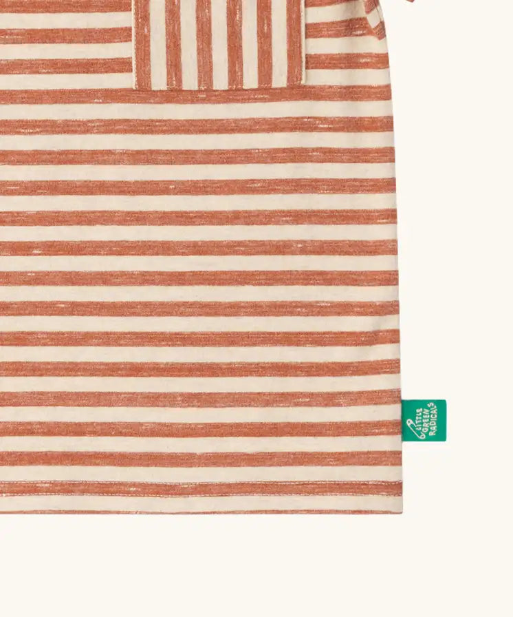 Close up of the green logo tag on the side of the pocket on the Little Green Radicals burnt ochre red striped short sleeve essential organic cotton t-shirt.