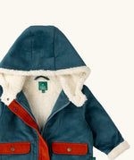 Close up of the sherpa fleece lining on the Little Green Radicals calm sea colourblock organic cotton toasty coat.