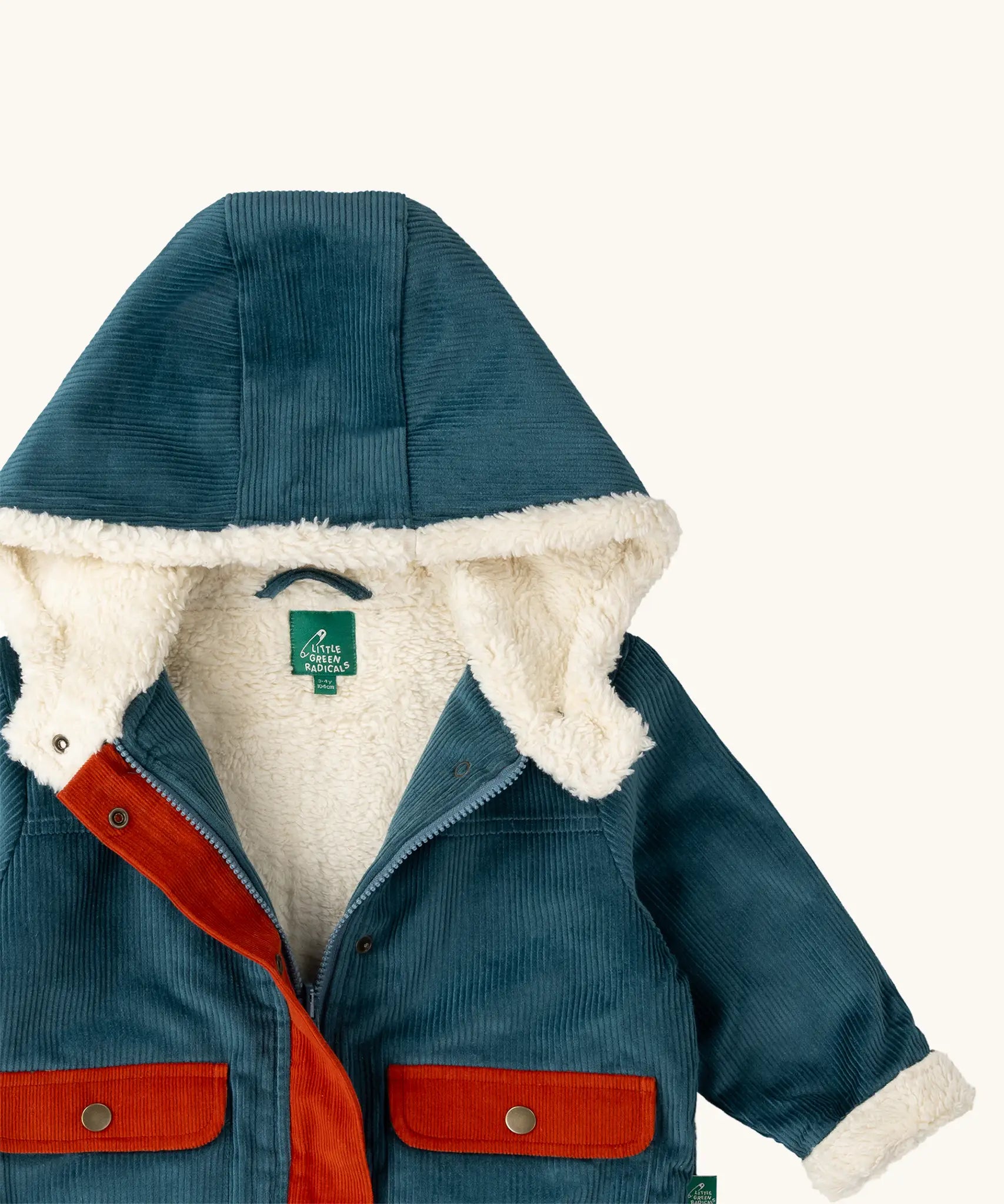 Close up of the sherpa fleece lining on the Little Green Radicals calm sea colourblock organic cotton toasty coat.