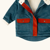 Close up of the pockets on the front of the Little Green Radicals calm sea colourblock organic cotton sherpa fleece lined toasty coat.