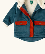 Close up of the pockets on the front of the Little Green Radicals calm sea colourblock organic cotton sherpa fleece lined toasty coat.