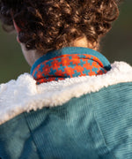 Close up of the lined hood on the Little Green Radicals calm sea colourblock organic cotton sherpa lined toasty coat .