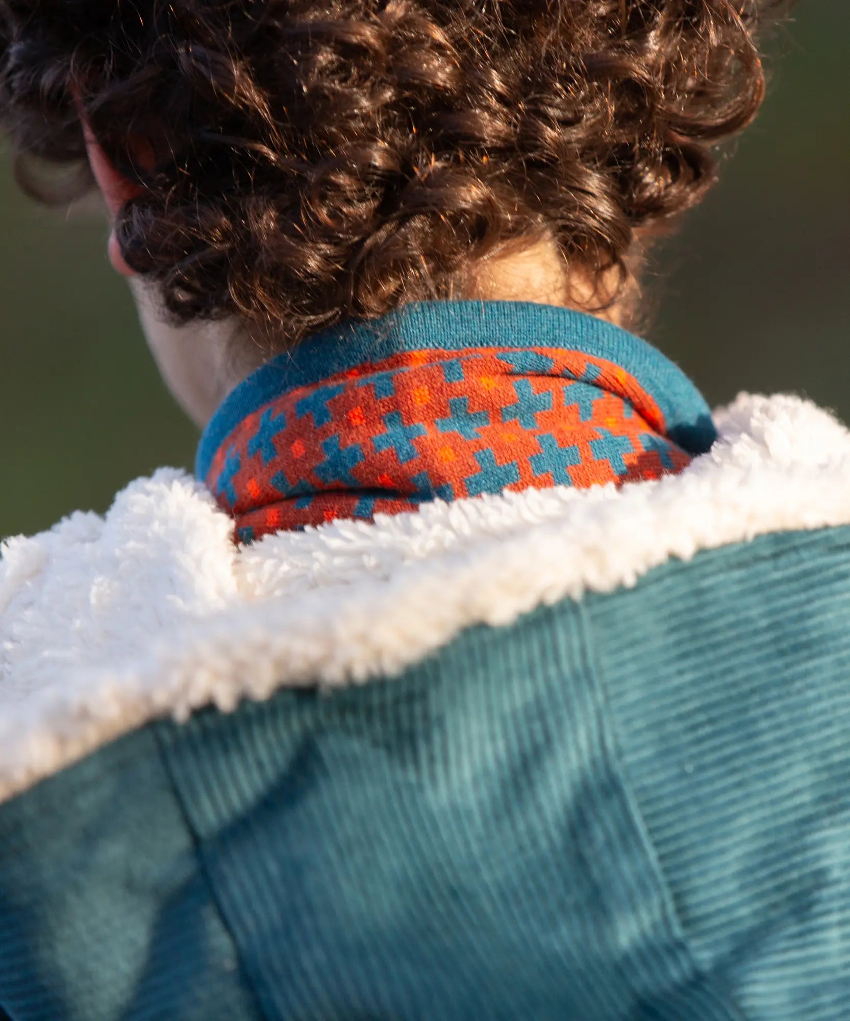 Close up of the lined hood on the Little Green Radicals calm sea colourblock organic cotton sherpa lined toasty coat .