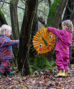 Child wearing the Little Green Radicals berry pink check classic pyjamas with another child wearing another colour way.